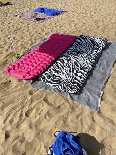 Customer using the Lounge Mat at the beach